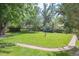 Large, well-maintained backyard featuring mature trees and a bird bath at 3225 S Race St, Englewood, CO 80113