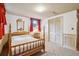 Bedroom with four-poster bed, vintage wallpaper, and closet at 3225 S Race St, Englewood, CO 80113