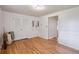 Bedroom with hardwood floors, closet, and decorative wall trim at 3225 S Race St, Englewood, CO 80113