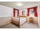 Bedroom with four-poster bed, vintage wallpaper, and carpeted floor at 3225 S Race St, Englewood, CO 80113