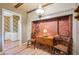 Breakfast nook featuring a brick fireplace accent wall with views to the hallway and vintage dining room at 3225 S Race St, Englewood, CO 80113