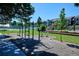 Outdoor exercise area with fitness equipment, a playground, and surrounding green space at 3225 S Race St, Englewood, CO 80113
