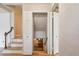 Hallway with closet and a staircase to the lower level at 3225 S Race St, Englewood, CO 80113