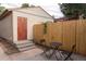 Backyard featuring a private patio, a small table, and an exterior door to the house at 2614 Curtis St, Denver, CO 80205
