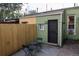 Backyard featuring a private patio, a small table, and an exterior door to the house at 2614 Curtis St, Denver, CO 80205