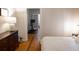 View from the bed showing a room with a dresser, an exercise bike, and french doors at 2614 Curtis St, Denver, CO 80205