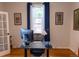 Functional home office with a large desk, window, and ample lighting at 2614 Curtis St, Denver, CO 80205