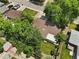 A high angle view showing the house, yard, mature trees, and neighborhood at 1373 S Cape Way, Lakewood, CO 80232