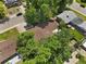 Aerial view of a home surrounded by lush trees, showcasing the roof and neighborhood at 1373 S Cape Way, Lakewood, CO 80232