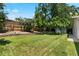 Green backyard with healthy grass and retaining wall, great for relaxation and outdoor activities at 1373 S Cape Way, Lakewood, CO 80232