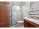Cozy bathroom with a shower, a toilet, and a well-lit vanity area at 1373 S Cape Way, Lakewood, CO 80232