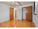 Bright bedroom featuring hardwood floors and ample closet space, perfect for relaxation at 1373 S Cape Way, Lakewood, CO 80232