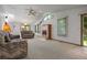 Bright living room features a fireplace, skylight and an outdoor view at 1373 S Cape Way, Lakewood, CO 80232