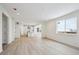 Open concept dining room with hardwood floors and kitchen view at 692 Apex Rise St, Erie, CO 80516