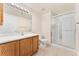 Bright bathroom vanity with walk-in shower at 3205 S Walden Ct # B, Aurora, CO 80013
