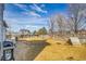 Wide backyard with a stone patio, grill, and wood fence at 270 N Holcomb Cir, Castle Rock, CO 80104