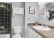 Neutral toned bathroom with black tiled shower and built in cabinet at 270 N Holcomb Cir, Castle Rock, CO 80104