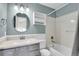 A bathroom with a shower-tub combo, a medicine cabinet, and a decorative mirror at 270 N Holcomb Cir, Castle Rock, CO 80104