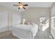 Cozy bedroom with vaulted ceiling, multiple closets, a ceiling fan, and carpeted flooring at 270 N Holcomb Cir, Castle Rock, CO 80104