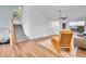 Bright living room with adjacent staircase, featuring hardwood floors, ceiling fan, and lots of natural light at 270 N Holcomb Cir, Castle Rock, CO 80104