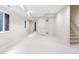 Spacious carpeted basement with recessed lighting, bright white walls, and egress window at 538 Cook St, Denver, CO 80206