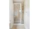 Bathroom features a glass-enclosed shower with tan tile surround at 538 Cook St, Denver, CO 80206