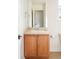 Bathroom with a vanity, warm wood cabinets, a white sink, and neutral countertops at 538 Cook St, Denver, CO 80206