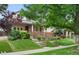 Charming two-story brick home with landscaped front yard and inviting curb appeal at 538 Cook St, Denver, CO 80206
