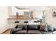Inviting living space with a breakfast bar that connects to a fully equipped kitchen and seating area at 538 Cook St, Denver, CO 80206