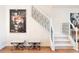 Elegant staircase featuring white risers, dark metal spindles, and stylish decor at 538 Cook St, Denver, CO 80206