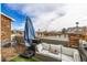 Outdoor rooftop deck featuring synthetic turf, brick and wood accents, and comfortable seating at 12888 Jasmine St # F, Thornton, CO 80602