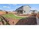 Expansive backyard with lush lawn, garden, and inviting patio area at 21 N Edge Cliff St, Castle Rock, CO 80104
