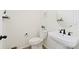Simple and elegant half-bathroom featuring a pedestal sink and minimalist decor at 21 N Edge Cliff St, Castle Rock, CO 80104