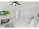Bright bedroom features a ceiling fan, television, large closet, and neutral decor at 21 N Edge Cliff St, Castle Rock, CO 80104