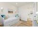 Bedroom with a daybed featuring drawers, neutral colors, bright lighting, and wood-look floors at 21 N Edge Cliff St, Castle Rock, CO 80104
