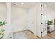 Light and airy entryway with wood floors, storage cabinet, and adjacent living space through glass doors at 21 N Edge Cliff St, Castle Rock, CO 80104