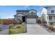 Charming two-story home with a well-manicured lawn and two car garage at 21 N Edge Cliff St, Castle Rock, CO 80104