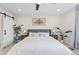 Stylish main bedroom with neutral decor, bedside tables, and a sliding barn door for a modern touch at 21 N Edge Cliff St, Castle Rock, CO 80104