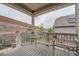 Cozy covered back porch with seating, offering a peaceful outdoor retreat at 8153 S Ider Ct, Aurora, CO 80016
