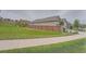 Side view of home showing the roof, the wooden fence, a retaining wall, and a neatly mowed backyard at 8153 S Ider Ct, Aurora, CO 80016