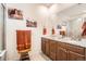 Beautiful bathroom features granite countertops, double sinks, a large mirror, and decorative wall art at 8153 S Ider Ct, Aurora, CO 80016