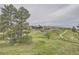 Scenic view of the community showing well-maintained landscaping, clubhouse, pool, and walking path at 8153 S Ider Ct, Aurora, CO 80016