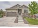 Charming home with well-maintained front yard, stylish stone accents, and a two-car garage in a Gathering-friendly neighborhood at 8153 S Ider Ct, Aurora, CO 80016