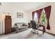 Office with a desk and chair, curtains and windows, an office sofa and plenty of storage at 8153 S Ider Ct, Aurora, CO 80016