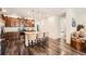 Modern kitchen with a center island, stainless steel appliances, granite countertops, and hardwood floors at 8153 S Ider Ct, Aurora, CO 80016