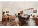 Open-concept living and dining area filled with natural light, featuring stylish decor and a seamless flow for entertaining at 8153 S Ider Ct, Aurora, CO 80016