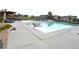 Community pool features lounge chairs for relaxing and well-maintained landscaping at 8153 S Ider Ct, Aurora, CO 80016