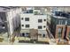 Aerial view of modern townhomes showcasing rooftop decks, contemporary design, and surrounding neighborhood at 1252 Yates St, Denver, CO 80204