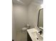 Modern bathroom with white vanity and black matte fixtures at 1252 Yates St, Denver, CO 80204