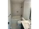 Clean bathroom with a white tub, toilet, and vanity at 1252 Yates St, Denver, CO 80204